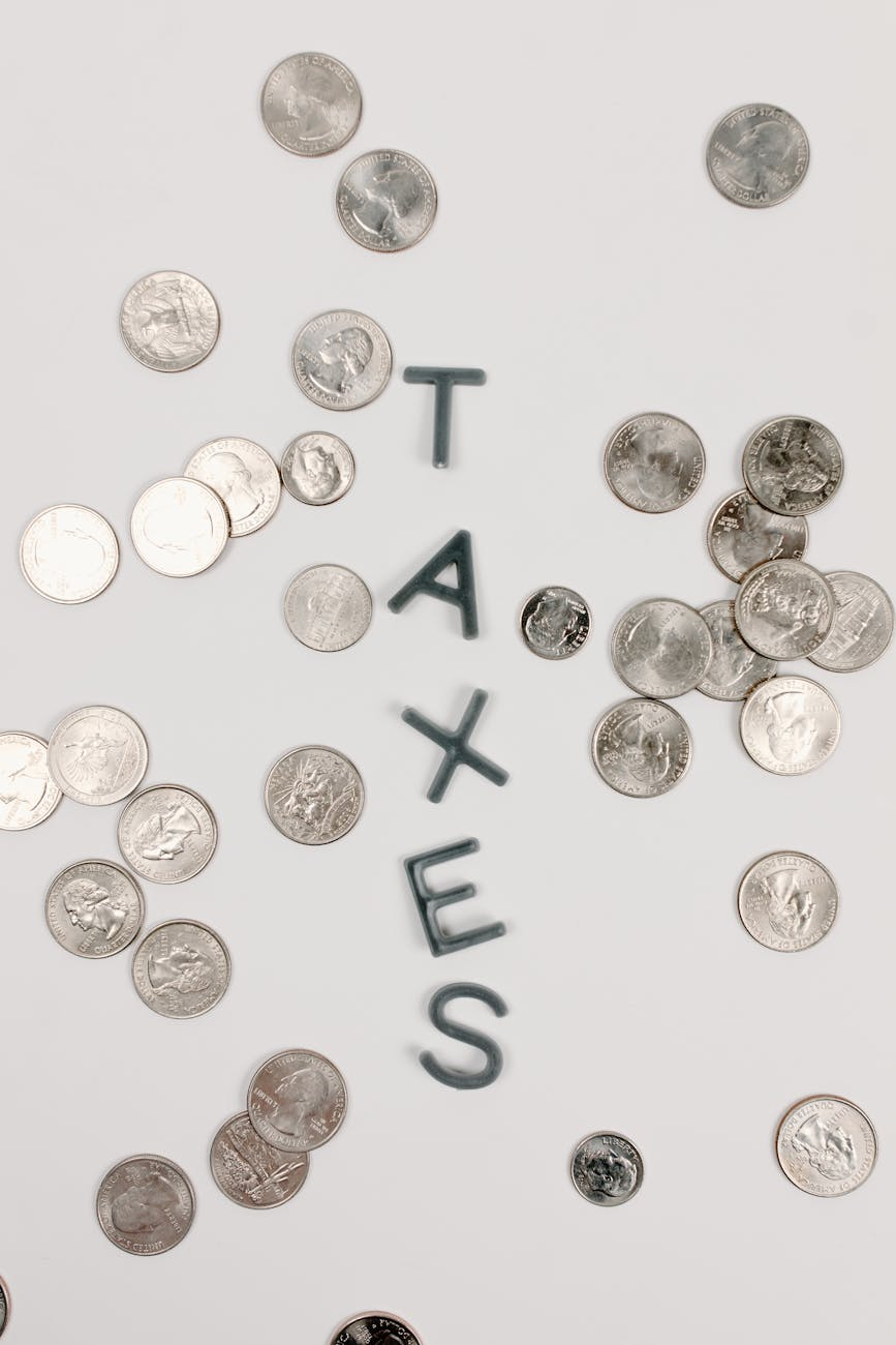 silver coins on white surface